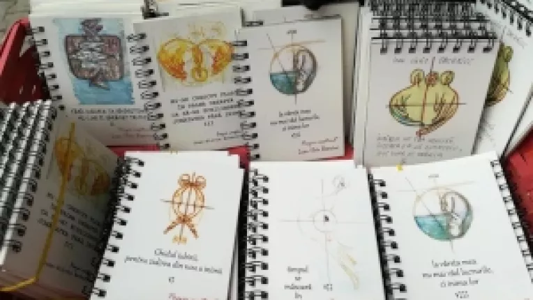 Silviu Batariuc are la standul sau de la targul de la MTR carticele cu poezii scrise si ilustrate de el